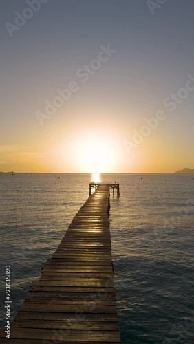 pier at sunset Platja de Muro on Mallorca	
