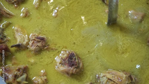 Close up opor ayam (chicken curry). This food is one of the Indonesia food, it tastes savory and slightly spicy photo