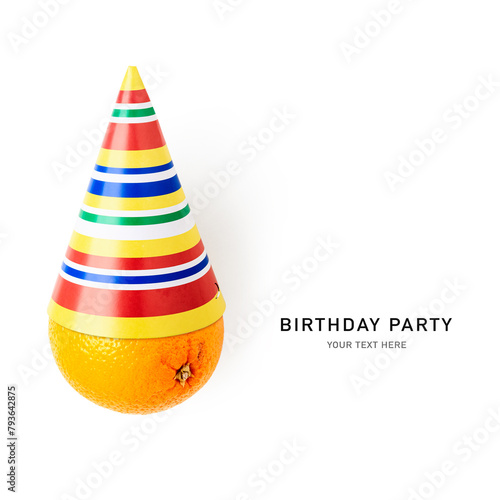 Colorful party birthday hat and orange fruit isolated on white background © ifiStudio