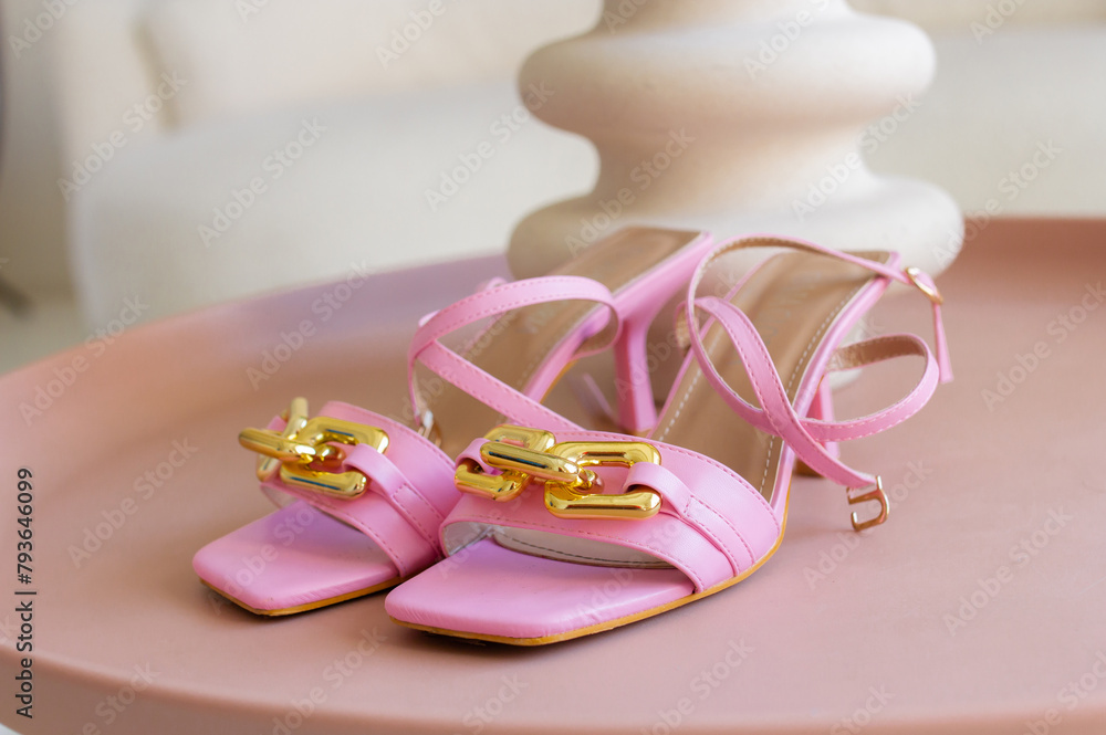 Woman fashion pink high heels for summer on beige background. Female shoes side view, feminine trendy content for shop Woman fashion pink high heels for summer on beige background. Female shoes side view, feminine trendy content for shop