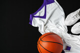 Basketball Outfit and Accessories Laid Out on Dark Background