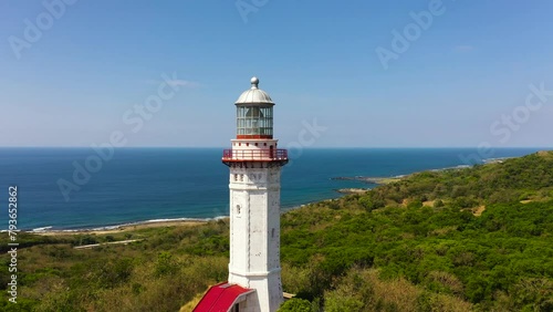 Aerial view of lighthouse on hill. Cape Bojeador Lighthouse, Ilocos Norte, Philippines. photo