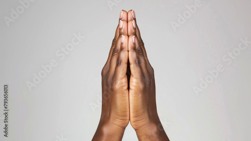 hands praying with plain background photo