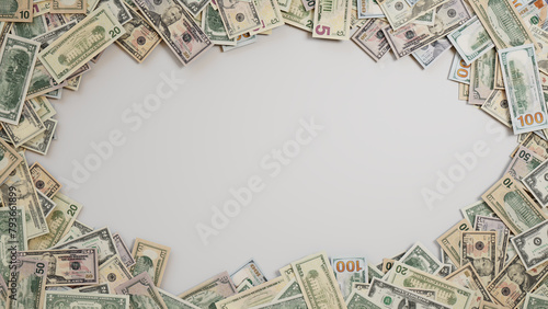 Mixed Denomination Bills Border on White Surface. Finance Background with copy-space. photo