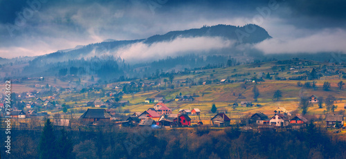 Dramatic autumn scenery. Panoramic morning view of Carpathian village. Majestic outdoor scene of mountain valley. Beauty of countryside concept background..