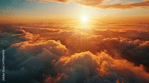 An aerial shot above beautiful sunset clouds with sun #793664616