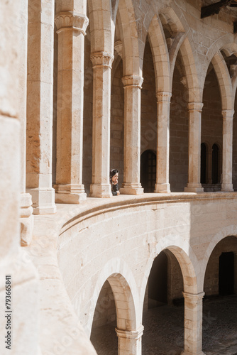 Woman Admiring the Architecture at Bellver Castle in Palma De Ma