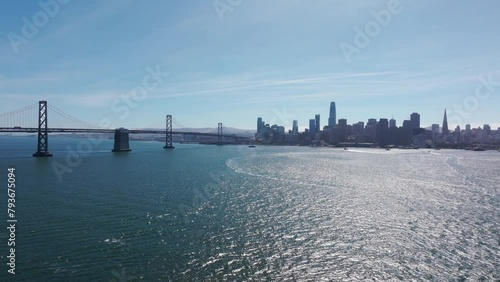 Drone shot flying towards downtown San Francisco with the Oakland Bridge