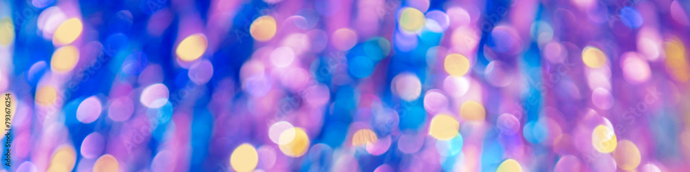 Blue-pink abstract background of blurred shiny lights. Horizontal banner
