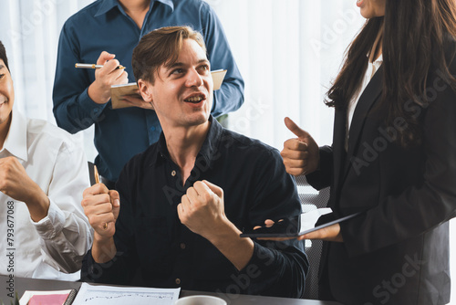 Excited and happy office worker employee celebrate after make successful strategic business marketing planning. Teamwork and positive attitude create productive and supportive workplace. Prudent photo