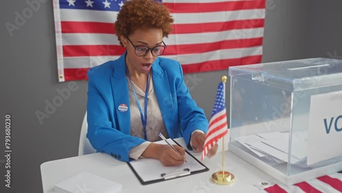 Amazed african american woman, an attractive governmental candidate, with mouth open in sheer disbelief and surprise, scared yet excited at the electoral college results photo