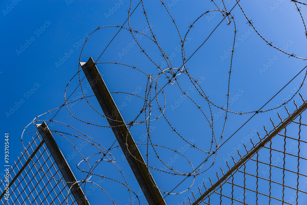 The other side of the barbed wire fence, the blue sky of freedom. The other side of the barbed wire fence, the blue sky of freedom.