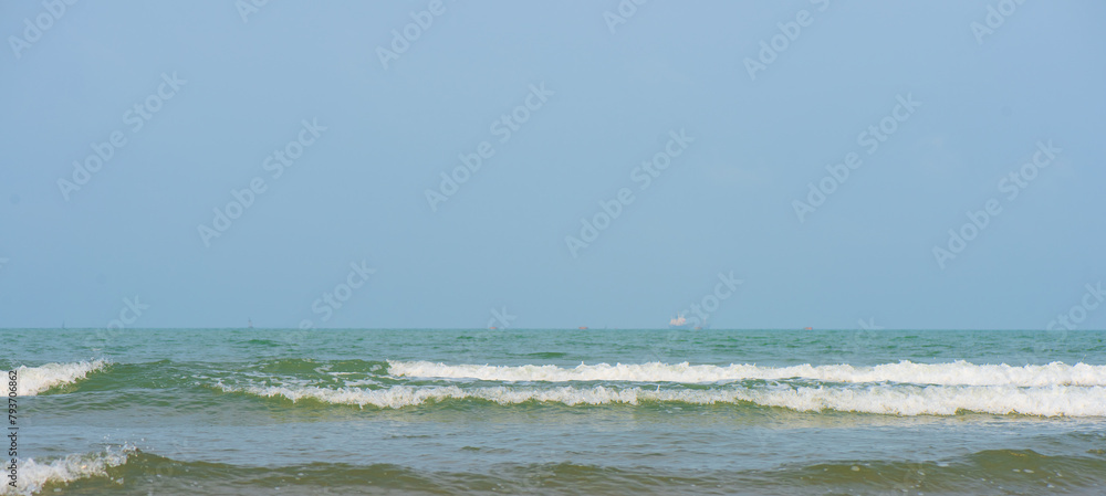 sea and sky. Bluewater waves on the surface ripples blurred. Defocus blurred transparent blue colored clear calm water surface texture with splash and bubbles. Water waves with shining pattern texture