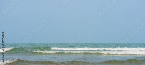 sea and sky. Bluewater waves on the surface ripples blurred. Defocus blurred transparent blue colored clear calm water surface texture with splash and bubbles. Water waves with shining pattern texture