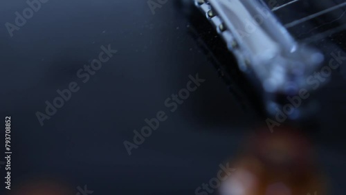 Close up pan of electric guitar photo