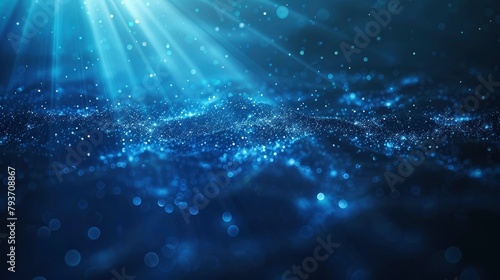 Abstract blue background with light rays and glowing particles