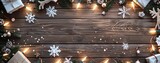 christmas decoration with snowflakes, reindeer, glowing lights, and wrapped gifts on wooden copyspace background. merry christmas