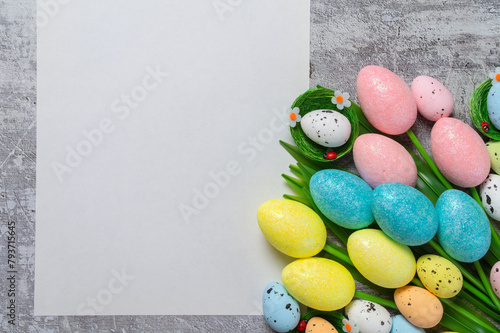 Tulip flower and easter eggs on grey concrete. Top view Easter background with copyspace