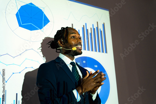 Obraz na płótnie Black man giving a presentation using a projector