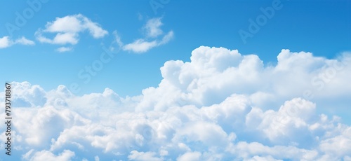 Blue sky background with tiny clouds photo