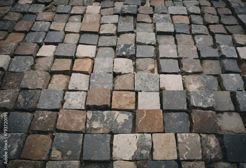 A rough and varied texture of closely packed stones  each with a unique pattern and a blend of earthy tones.