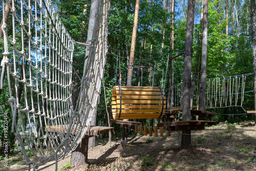 Summer activity. Rope park. Rope ladders.  Sport. Children's playground in nature in the forest.