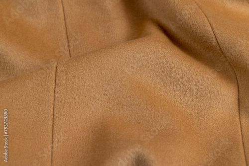 orange fleecy fabric is part of a garment, part