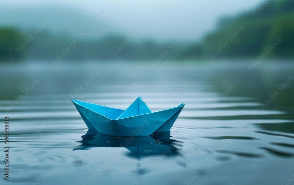 Mist hovers over the water where a blue origami boat floats, evoking a sense of mystery and calm.