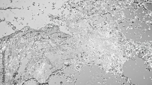 Water Splashes Flying in the Air on White Background