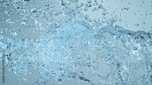 Water Splashes Flying in the Air on Blue Background
