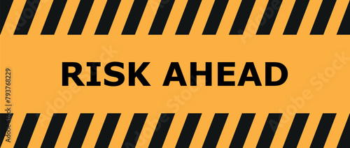 yellow road sign as a warning of risk ahead