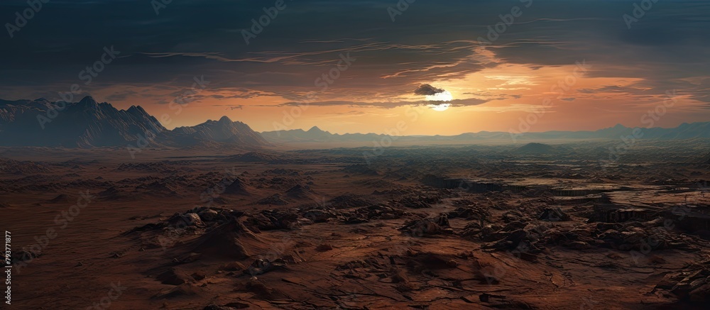 Desert landscape with distant sunset