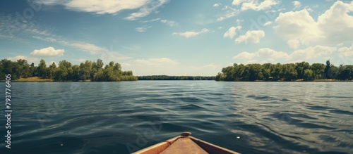 Boat on serene lake amid trees