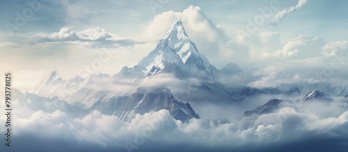 Snow-capped mountain amidst rugged peaks photo