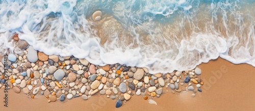 A wave approaching the sandy beach photo