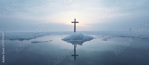 Cross on secluded island amidst vast ocean photo