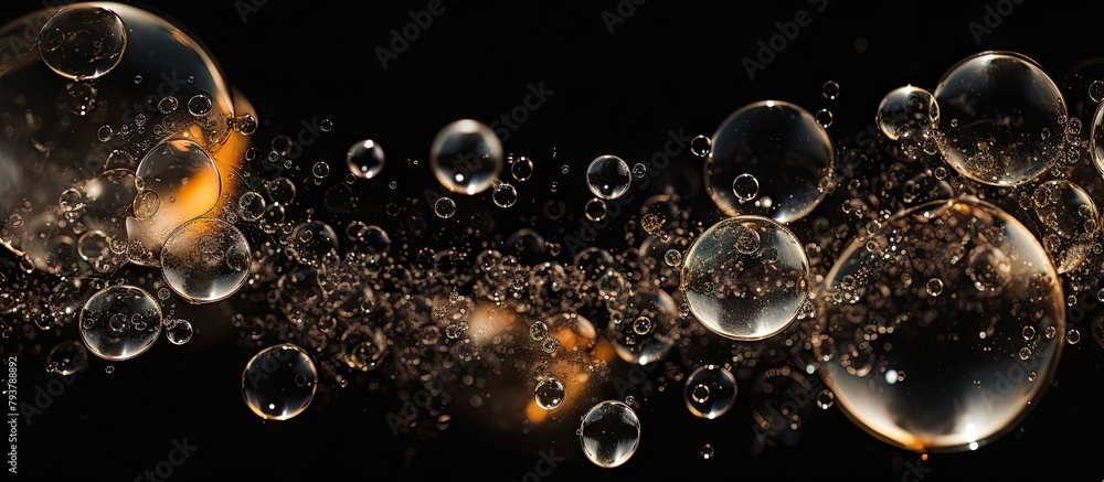 Water bubbles float on black surface - obrazy, fototapety, plakaty 