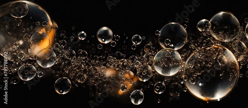 Water bubbles float on black surface