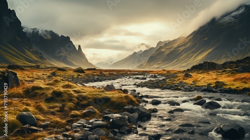 b'A river flowing through a valley in the mountains' photo