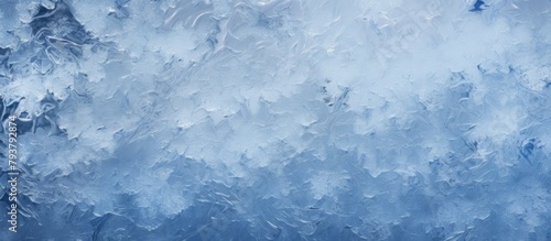 Frosty window against blue sky