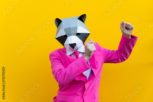 Man with funny low poly mask on colored background © oneinchpunch