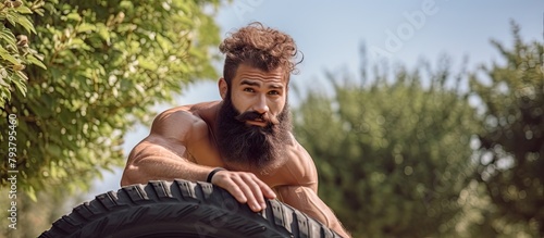 Man bearded male with facial hair resting perch on wheel