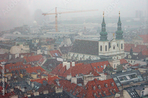 The Jesuit Church, also known as the University Church , is a two-floor, double-tower temple in Vienna, Austria. View from the observation deck of St. Stephen's cathedral during heavy snowfall