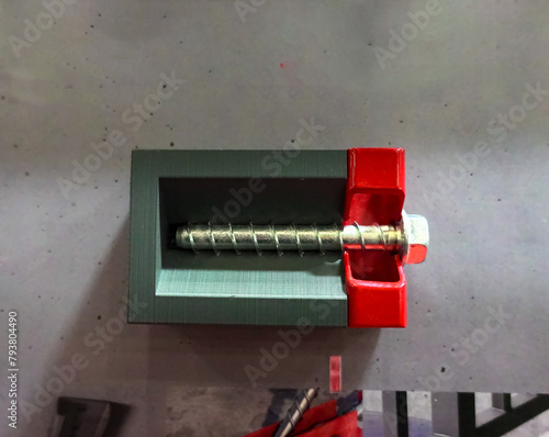 Reusable mounting screw for concrete. Usage example