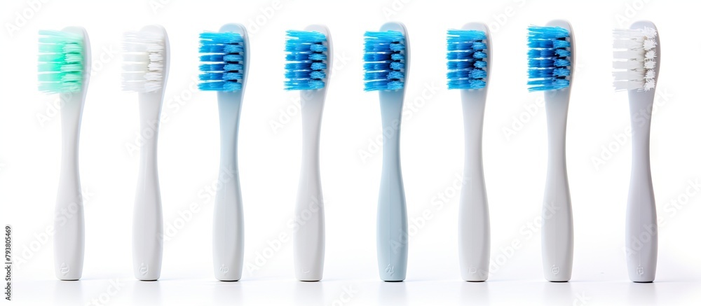 Five toothbrushes in a neat line Five toothbrushes in a neat line