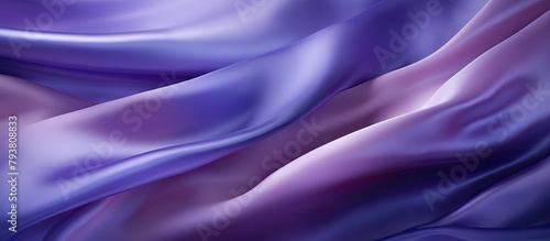 Purple silk fabric draping softly against muted background
