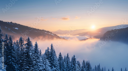 Clouds over the mountains and forest at foggy sunrise.