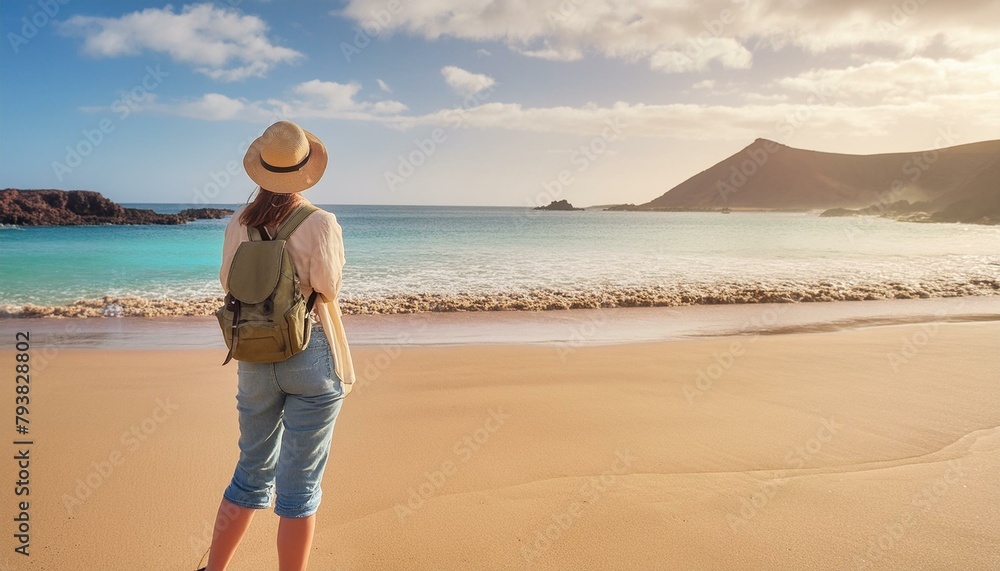 couple walking on the beach, Jumping girl on beach. Smilling blonde girl enjoying sandy beach, looking at crystalline sea in Canary Islands. Concept of beach summer vacation with kids.