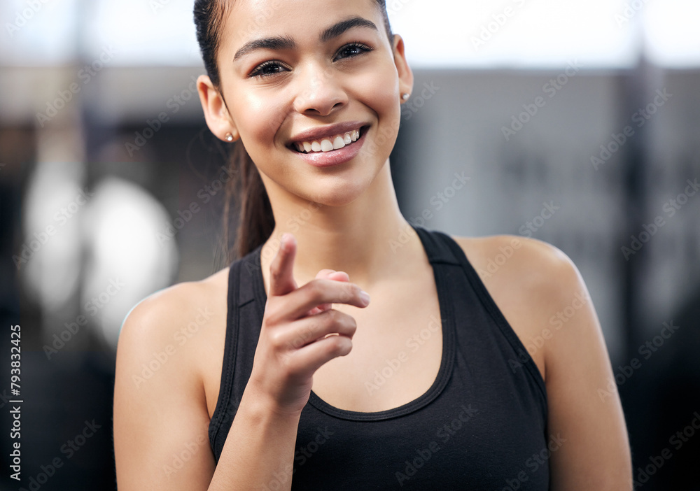 Portrait, girl and pointing in gym, smile and fitness with training, health and recruitment to club. Promotion, you and happiness of athlete, choice and offer for wellness, sportswear and exercise Portrait, girl and pointing in gym, smile and fitness with training, health and recruitment to club. Promotion, you and happiness of athlete, choice and offer for wellness, sportswear and exercise