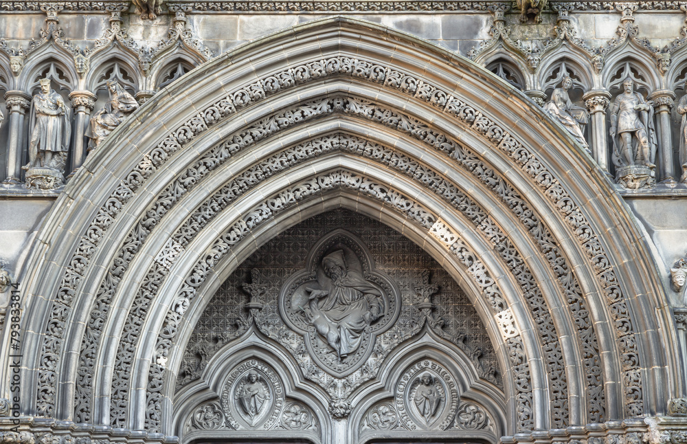 Picturesque exterior view of Ornamental stonework arch above of The thistle chapel in St Giles' Cathedral (The High Kirk) entrance in Edinburgh. The most important place of worship in the Edinburgh.